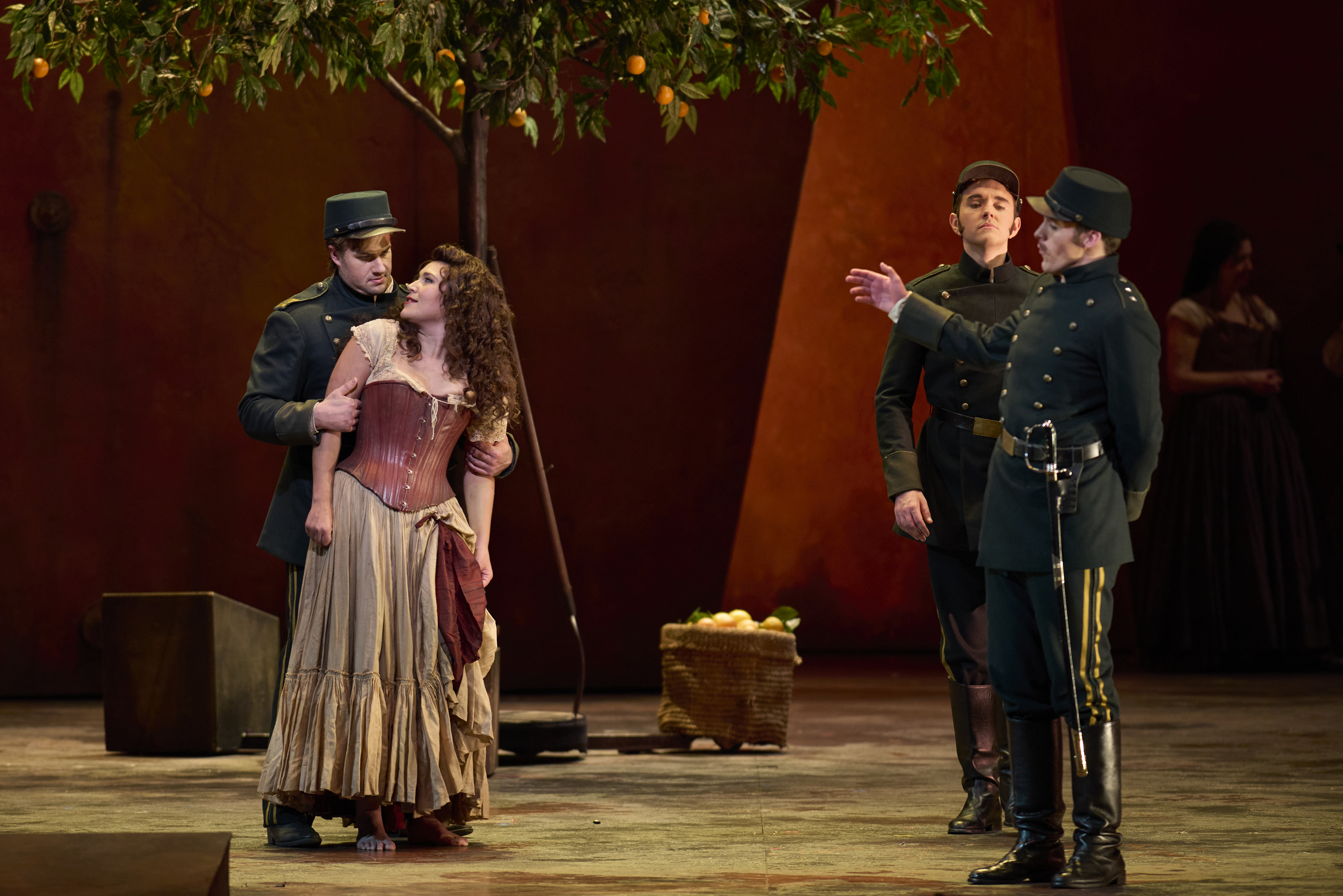 Nikola Printz as Carmen, Thomas Kinch as Don José, James McCarthy as Zuniga, and Samuel Kidd as Morales in Carmen.